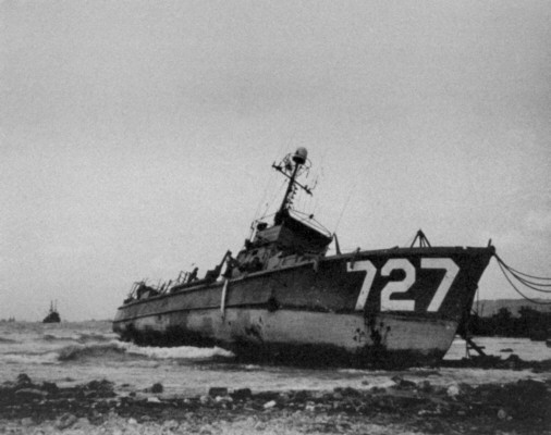 SC 727 grounded on rocks at Buckner Bay, Okinawa, 1945.